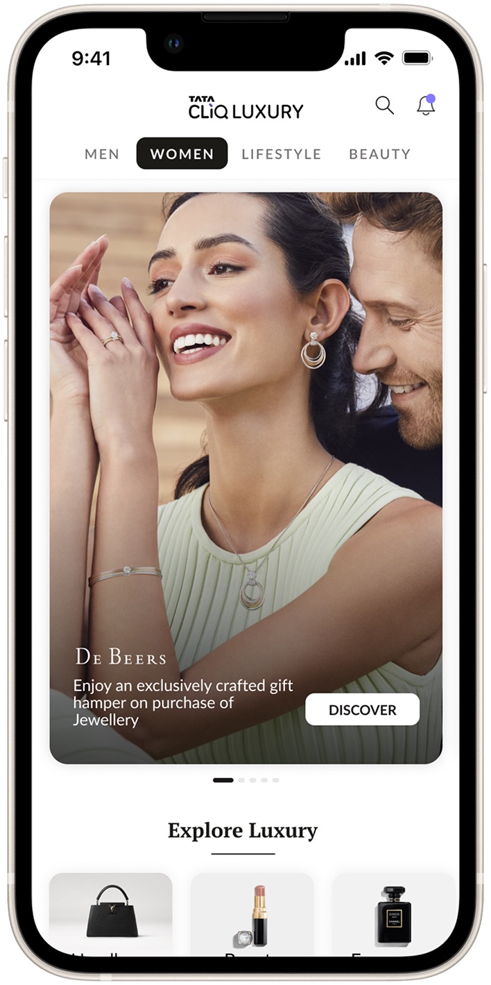 The new homepage: an immersive hero with store tabs and curated brand content.